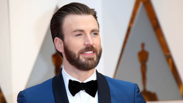 Chris Evans in a blue suit on the red carpet